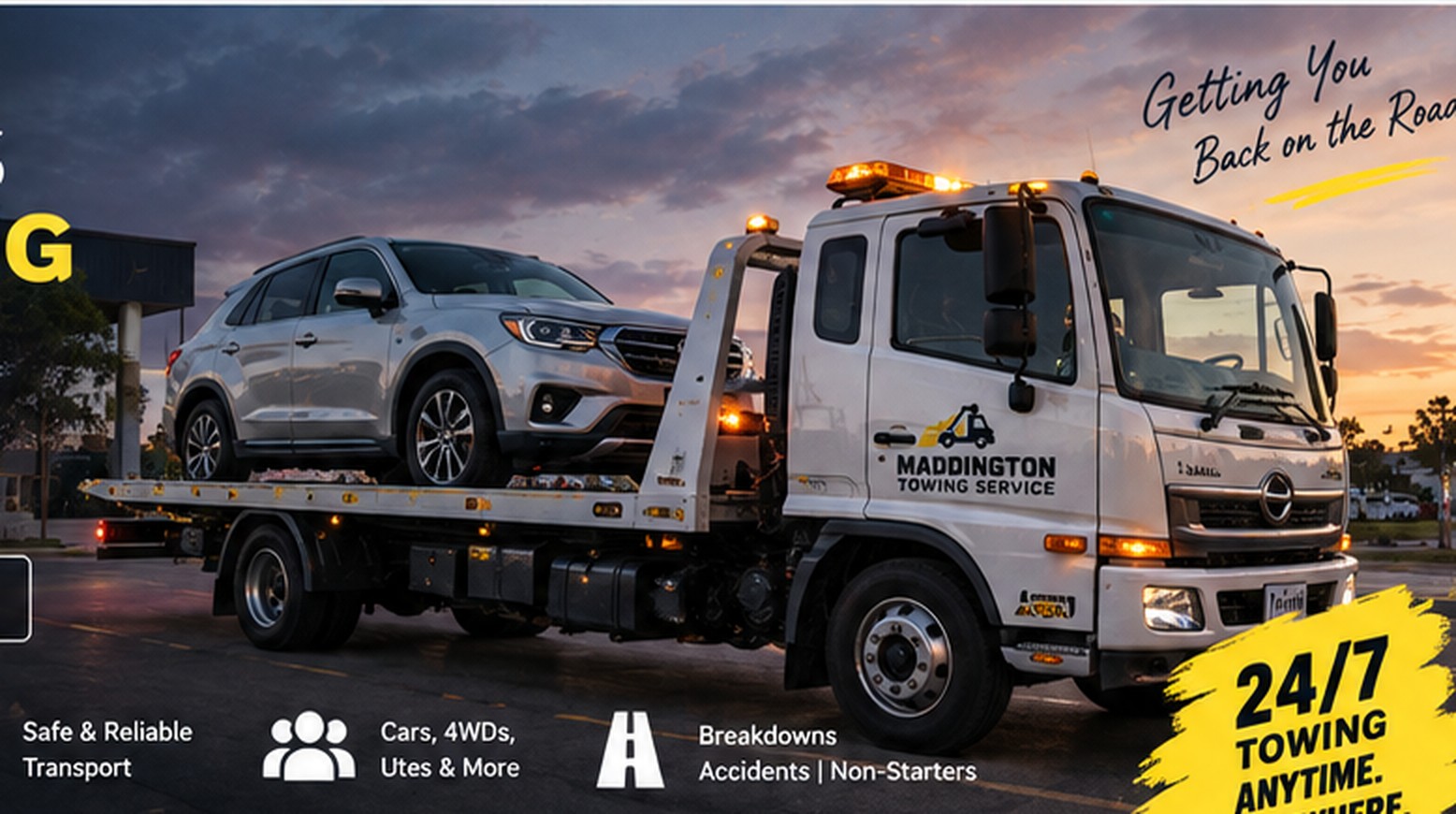 Tow truck transporting vehicle